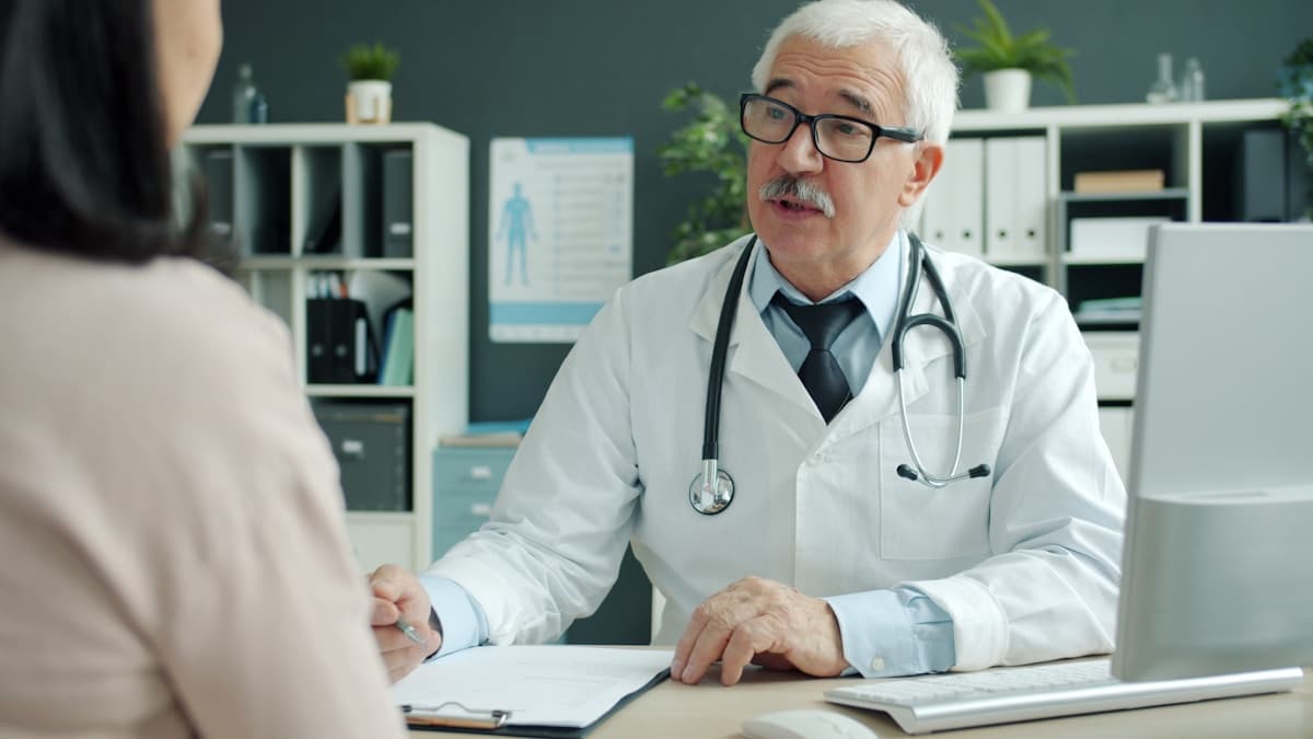 Doctor consulting with patient about weight loss treatment options
